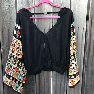 Free People black embroidered bell sleeve top. Size small.
